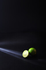 One lime in light ray in low key