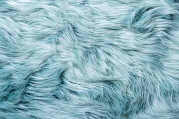 Fur texture top view. Turquoise fur background. Fur pattern. Texture of turquoise shaggy fur. Wool texture. Flaffy sheepskin close up
