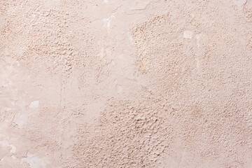 Grunge background with old stucco wall texture of beige color. Empty beige rusty stone surface texture. Copy space
