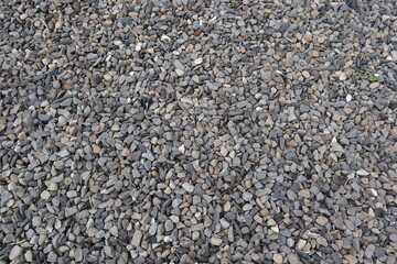 organic shapes of grat rocks on the beach design for material textured background
