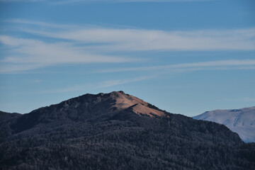 Silhouettes of mountains and dark forest in background. Wildlife untouched by man is beautiful. Beautiful view of mountain landscape and autumn valley in national park.