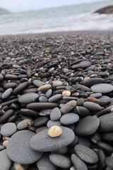organic shapes of grat rocks on the beach design for material textured background