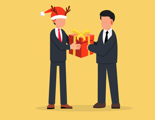 Obraz premium Businessman in a santa claus hat giving a gift to a colleague.Corporate worker Christmas and New Year congratulations.