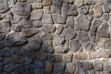 Retaining wall faced with natural rough stones different sizes