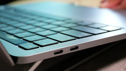 Selective focus of woman hand open laptop for online the internet to work from home or shopping in the website