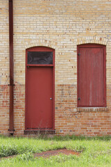 Close-up Building Detail Historical Brick Wall With Doors and Windows