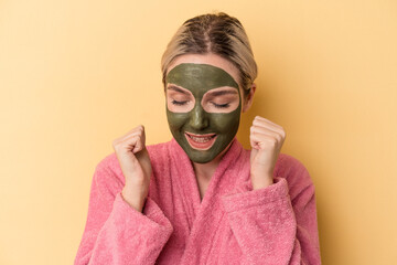 Young caucasian woman wearing face mask isolated on yellow background