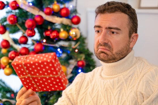 Man Feeling Disappointed For A Bad Christmas Present