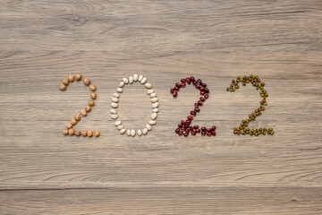2022 New Year and New You with organic Beans; red, white, green, chickpeas and Adlay on table. Goals, Healthy, Motivation, Resolution, Weight loss, dieting and world food day concept