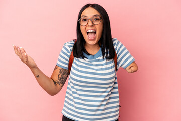 Young caucasian student woman with one arm isolated on pink background receiving a pleasant...