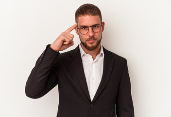 Young business caucasian man isolated on white background pointing temple with finger, thinking, focused on a task.