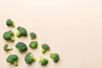 Top view fresh green broccoli vegetable on Colored background. Broccoli cabbage head Healthy or vegetarian food concept. Flat lay. Copy space