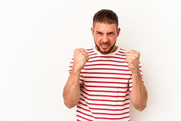 Young caucasian man with diastema isolated on white background upset screaming with tense hands.
