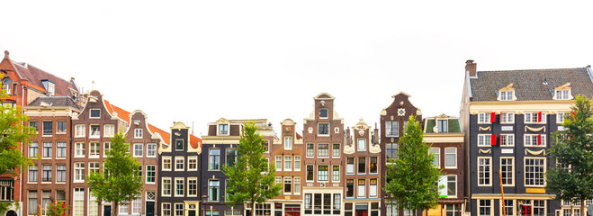 Panoramic view of Amsterdam houses - background isolated on white. Various traditional houses in the historic center of Amsterdam. Amsterdam, Holland, Netherlands