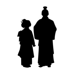 Silhouette of dad and daughter in national asian costume.