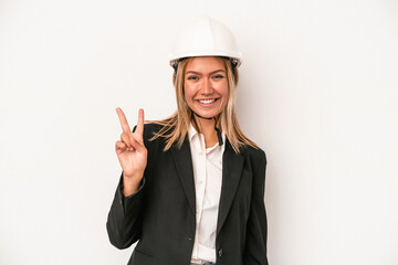 Young caucasian architect woman wearing a helmet isolated on white background showing number two with fingers.
