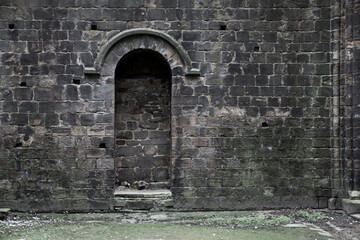 Fototapeta premium Bricked up doorway in an old gothic building