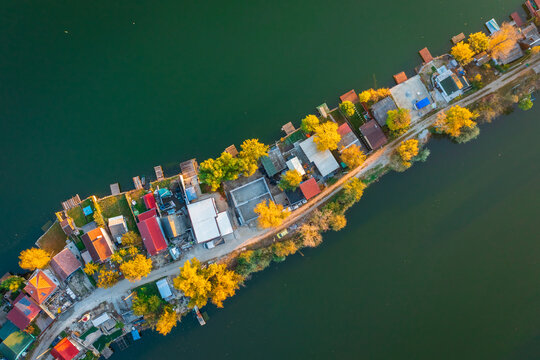 Szigetszentmiklós, Hungary - Aerial drone view of tiny fishing island on Lake Kavicsos near Budapest. The island is full with fishing huts, piers and cabins. Hungarian name is Kavicsos tó.