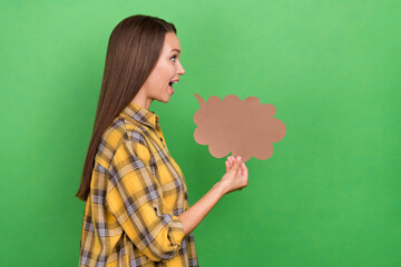 Fototapeta premium Profile photo of satisfied young lady hold cloud shape look empty space isolated on green color background