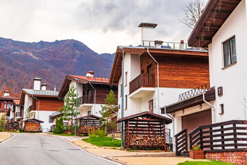 Traditional chalet houses and hotels in Rosa Khutor resort. Mountain Olympic village in the Caucasus Mountains.