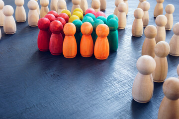 Inclusion concept. Group of color figures and wooden ones.