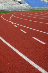 Red running track in sport stadium