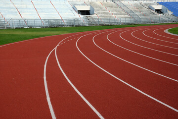 Red running track in sport stadium
