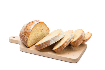Fresh loaf of bread sliced on wooding cutting board on white background.