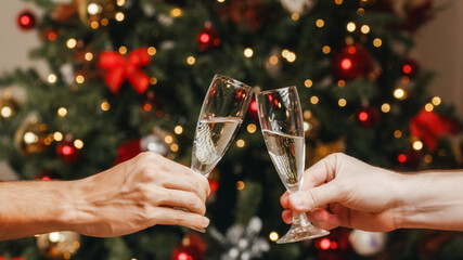 Couple making a toast with champagne for Christmas