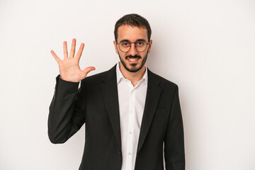 Young caucasian business man isolated on white background smiling cheerful showing number five with fingers.
