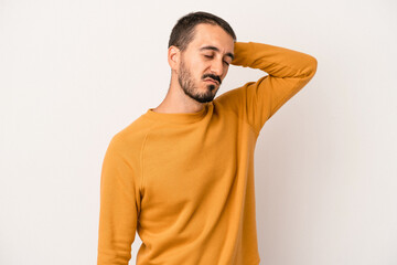 Young caucasian man isolated on white background tired and very sleepy keeping hand on head.