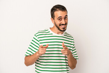 Young caucasian man isolated on white background pointing to front with fingers.