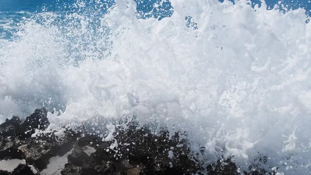 Waves breaking over dangerous rocks, Sea storm concept, Ocean waves crash on the rocks, Creating an explosion of water in 4k