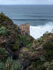 Old ruin building at the sea with waves in Los Realejos, Garachio, Tenerife