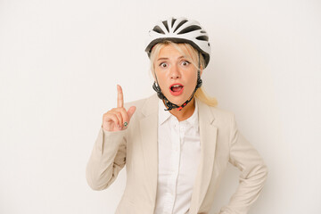 Young business Russian woman holding bike helmet isolated on white background having an idea, inspiration concept.