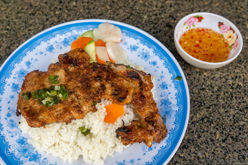 Vietnamese grilled pork chop and fried egg rice- Com Tam