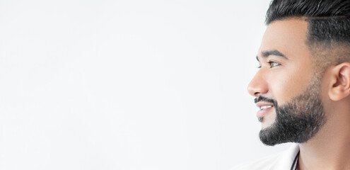 Handsome man. Masculine power. Advertising banner. Happy arabian male person with careful beard isolated white background wide ledge.