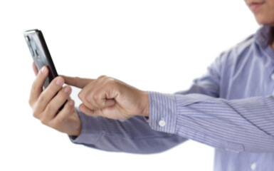 Businessman holding smartphone for business work.