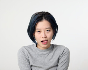 Young attractive Asian chinese malay woman pose face body expression mode emotion on white background tongue out horny look