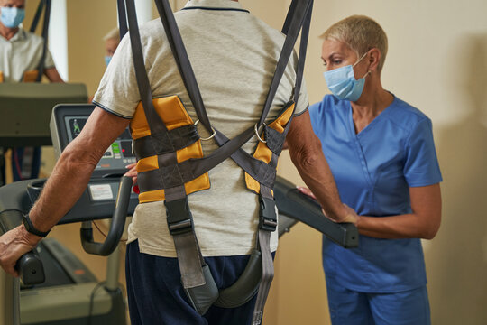 Stroke Patient Using Treadmill To Walk In Rehab Center