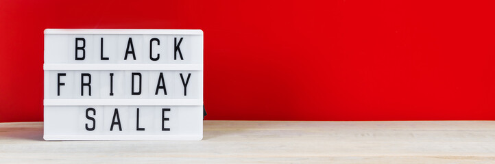 Black Friday concept. Sign on red background.