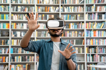Young indian student using VR simulator for studying in university library