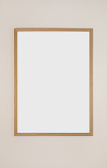 Blank frame hanging on light wall. Space for design