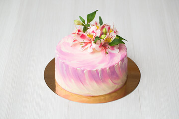 Cake with pink decor and flowers