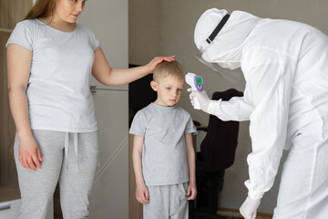Pediatrician or doctor checks elementary age boy's body temperature using infrared forehead...