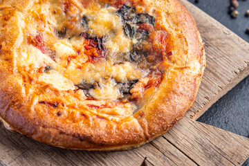 Pizza fresh homemade baking tomato sauce and lot of cheese fast food meal snack on the table copy space food background rustic. top view