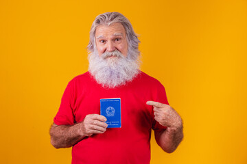senior bearded teenager holding a Brazilian work card