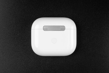 white wireless headphones on background