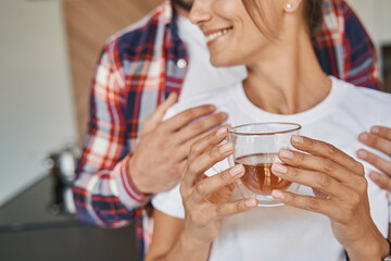 Man hugging his girlfriend in home apartments