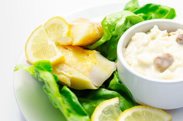 Steamed haddock fillet served with an exquisite salad consisting of cabbage, celery and apple with sultanas and roasted peanuts in mayonnaise